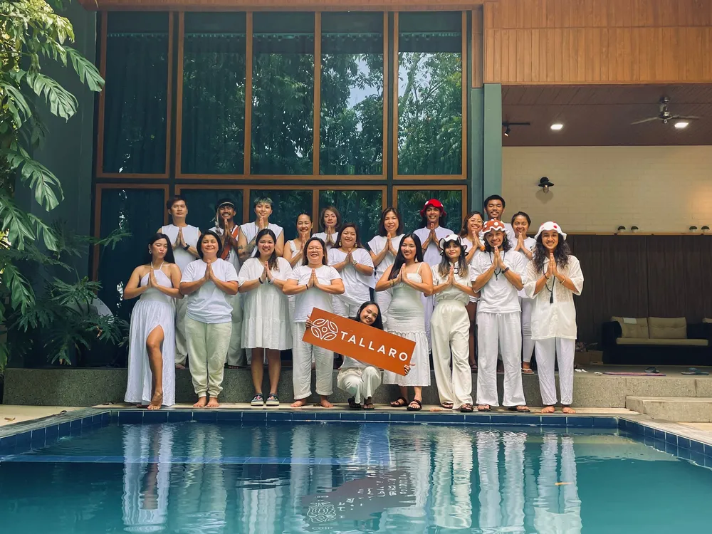 Friends and family relaxing together by the pool during a private Tallaro retreat